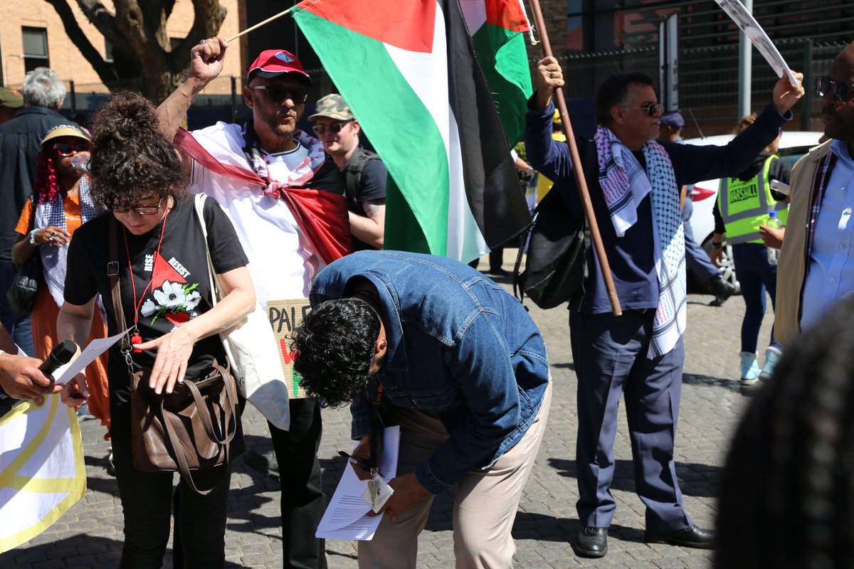 Minister Parks Tau’s spokesperson, Mr Kaamil Alli receiving a memorandum from the South African BDS Coalition energy embargo campaign who are calling for South Africa to stop exporting coal to Israel. The group is protesting at the dtic offices in Pretoria.