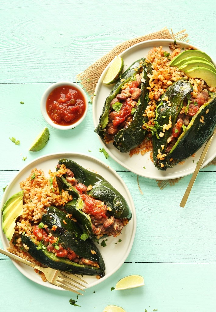 Dinner tonight...? 🤔 Try these EASY, 9-ingredient Vegan STUFFED PEPPERS! 🫑 They're hearty, satisfying &amp; flavorful with poblano peppers, seasoned brown rice 🍅🌿, pinto beans 🫘 &amp; a simple avocado crema 🥑. Who's in?! Tap the link for the recipe: l8r.it/LOhT