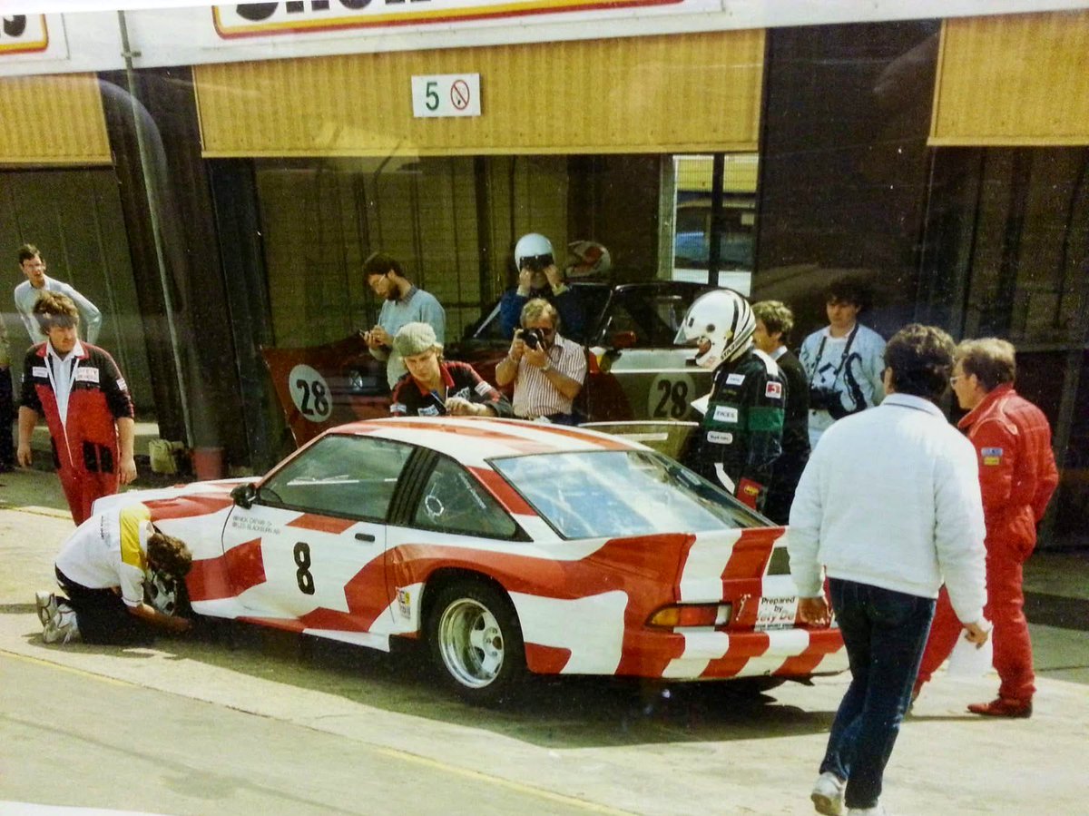 From the Archive: Thursday Throwback! 

Driver change for the Stars &amp; Stripes Opel Manta V8 at Brands Hatch, 1987 🇺🇸

Nick Oatway &amp; Holman Blackburn took the Manta to a race win 🏆🏁 

#Thundersaloons | #OpelManta | #BrandsHatch