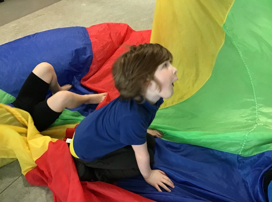 Towerside class used the parachute to work on directional language today. As you can see, everyone had lots of fun and lots of practice of 'under'!