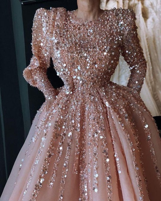 Stunning blush gown adorned with shimmering sequins, perfect for a glamorous evening.

details on sequins

evening fashion trends