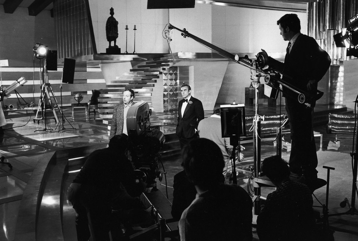 BondinColour's tweet image. Director Guy Hamilton and Sean Connery on Willard Whytes office (or is it Blofelds?) set filming Diamonds are Forever. #jamesbond #seanconnery   #diamondsareforever  #colourised
