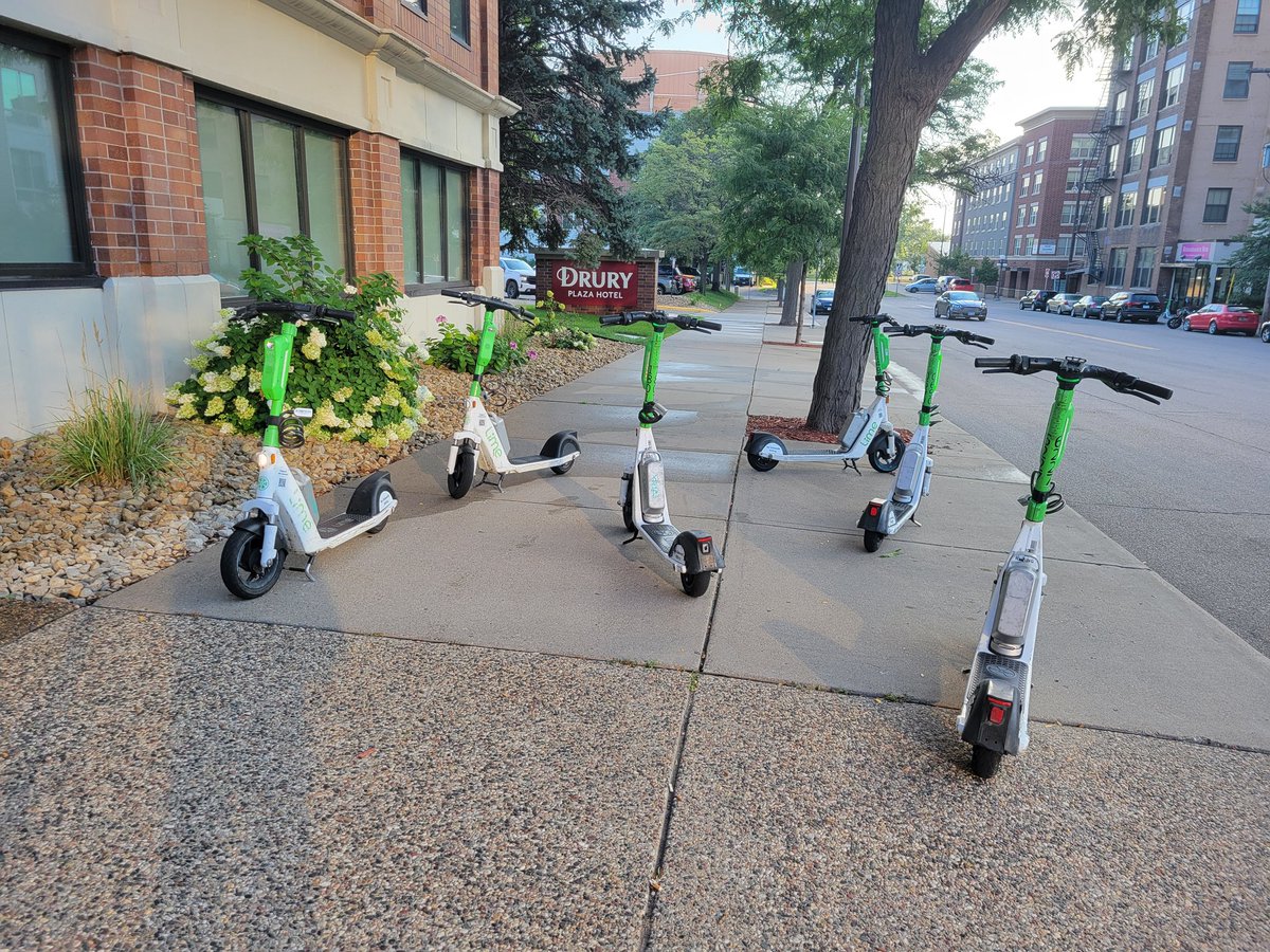 Collective noun for a group of Lime+Uber scooters blocking the sidewalk: an inconvenience. It's also an accessibility issue. Please be considerate and park your scooters/bikes in a way that allows others to navigate the sidewalk freely and safely. <a href="/cityofsaintpaul/">City of Saint Paul</a> <a href="/Uber/">Uber</a> #a11y