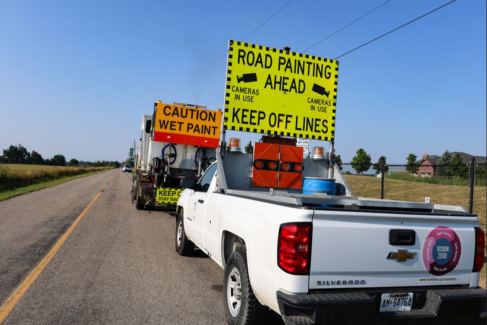 cityofhamilton's tweet photo. Our road painting program is underway. Crews are refreshing crosswalks and lane markings to help keep motorists, cyclists &amp; pedestrians safe. Thank you for your continued patience as we complete these maintenance activities that help keep our roads and community safe. https://t.co/hAdyYZMG2J