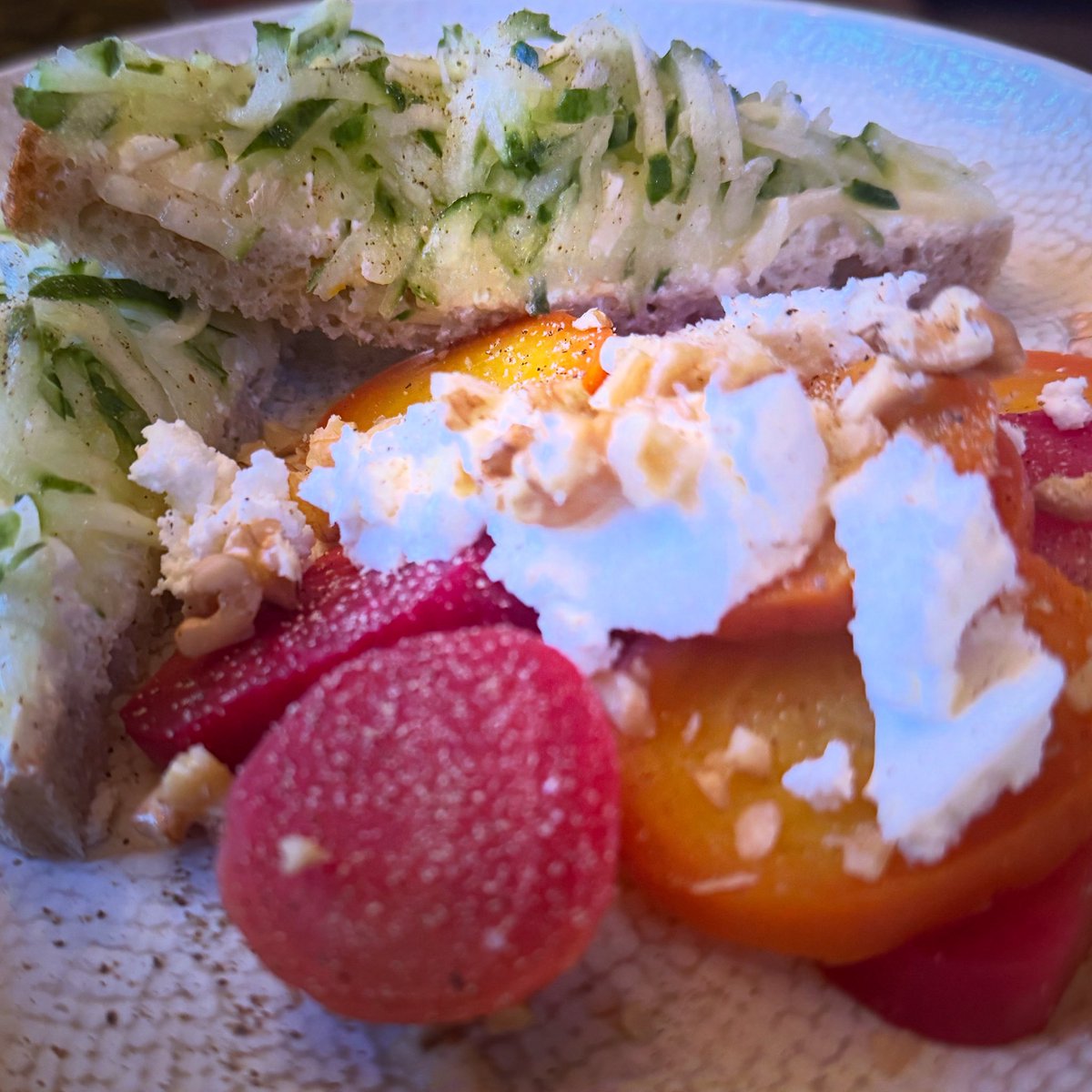 Messy, simple, homegrown.

Grated cucumber and onion on spelt bread, golden and candy beetroot with goats cheese and walnuts.