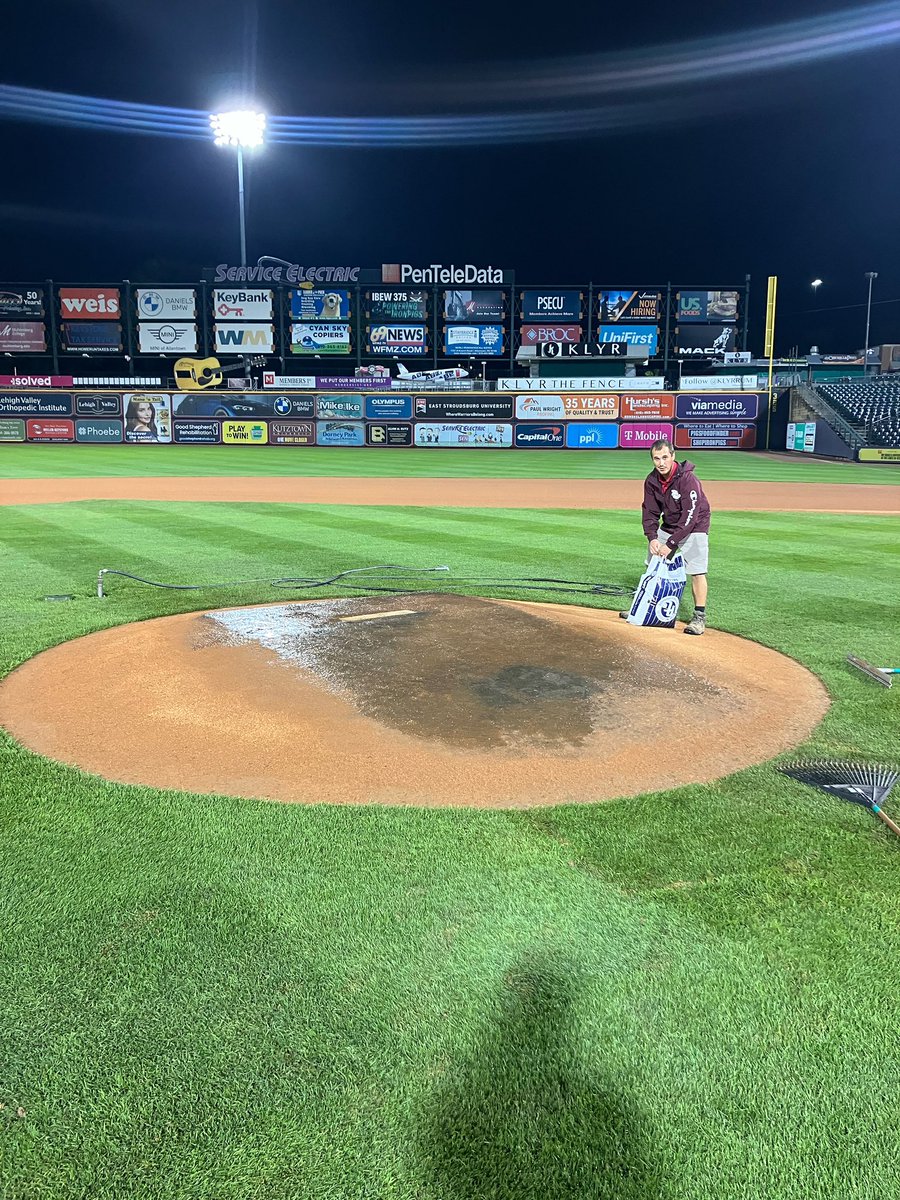 Here’s a great pic of the game mound as Mike is finishing up his postgame repair after a night included a first pitch delay and light rain through the first half of the game. He’s got the clay patched and slicked and is about to add conditioner before tarping it for the night.