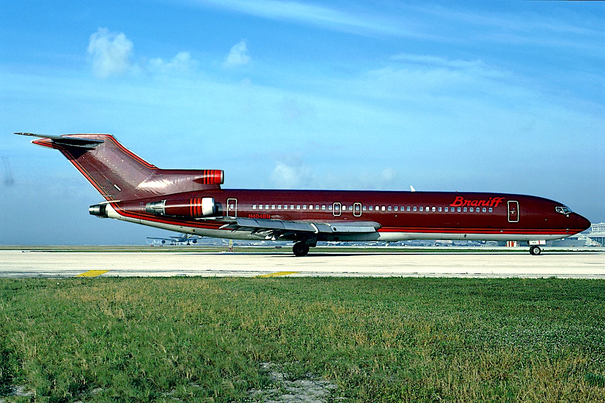 A SPARKLING BRANIFF ULTRA SPACE JET - Braniff International Boeing 727-2B7 registered a N404BN is taxiing at Miami International Airport, Florida, in December 1979. The one-of-a-kind painted Braniff jetliner features the 1978 Harper and George/Cars and Concepts/Halston Metallic