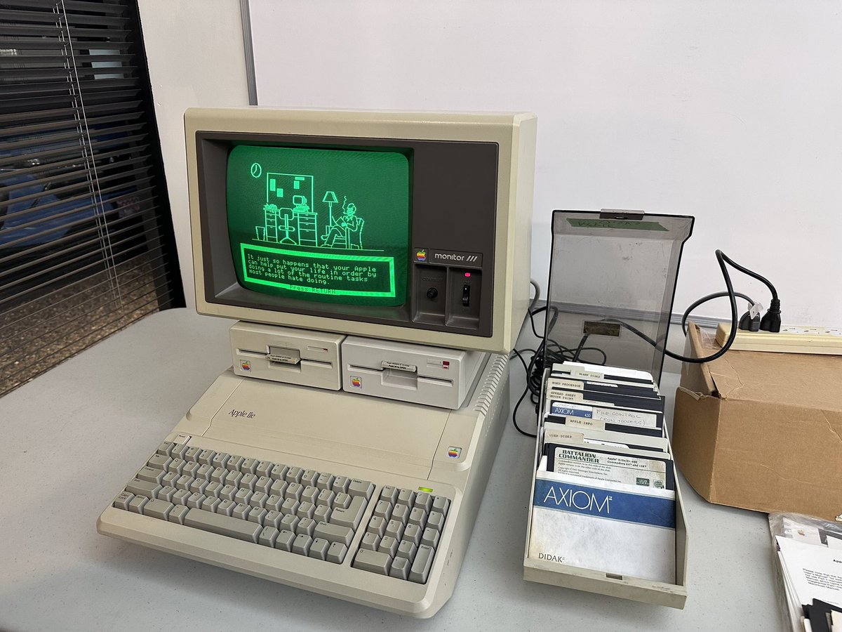 Apple At Work promo disk shows a guy sitting and having a puff on his pipe 😃