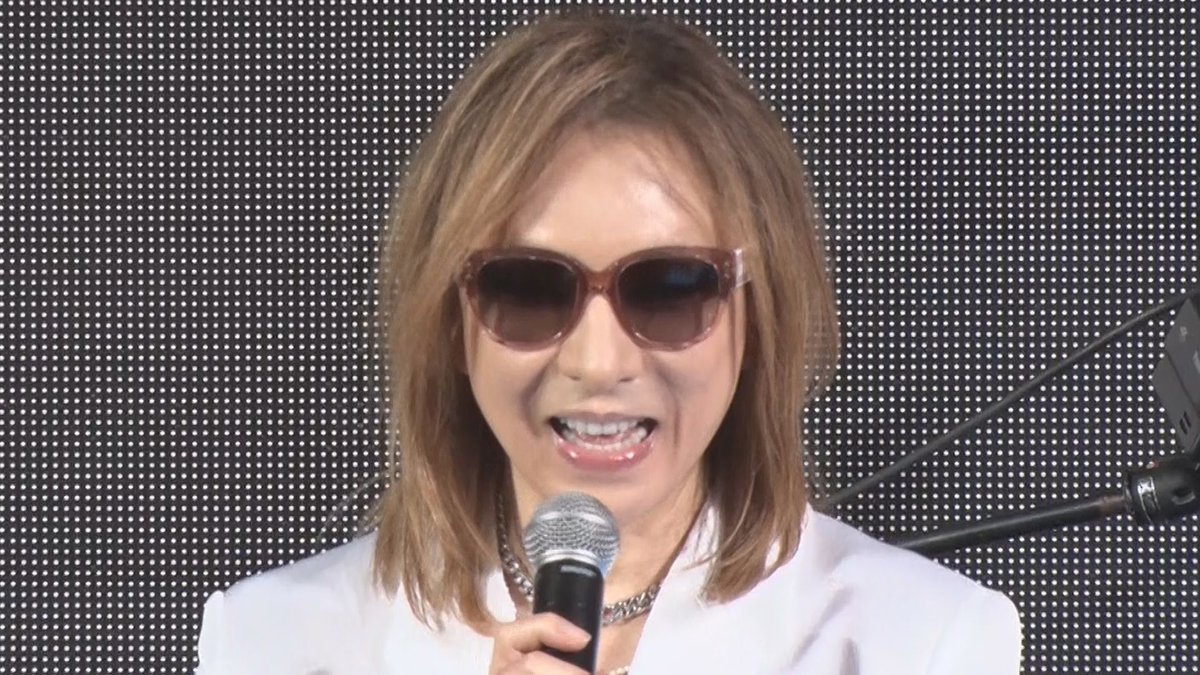 YOSHIKI speaking at an event