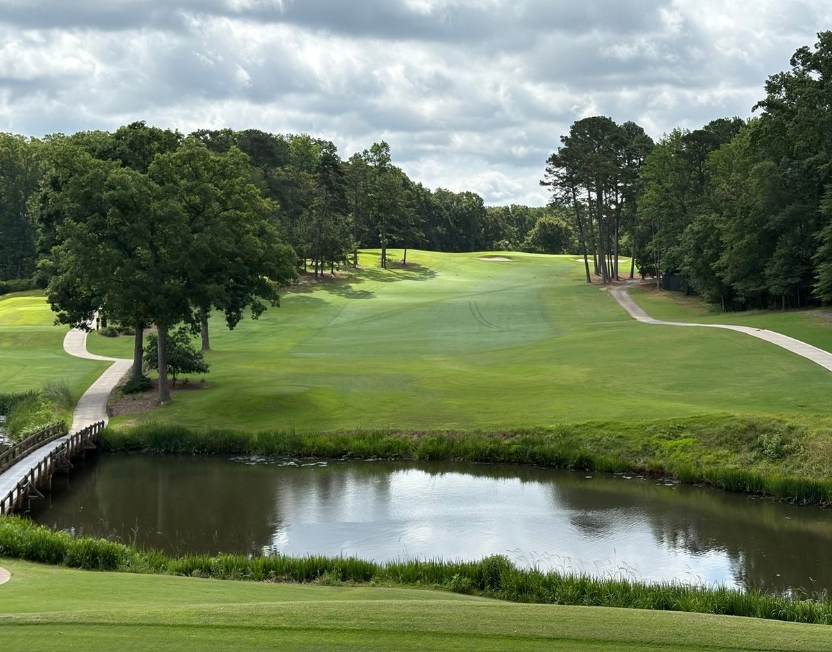UGAGolfCourse's tweet image. ✨Happy Flashback Friday!✨ This week we’ve got #14—the par 4 that proves the pond isn’t done with you just yet. So what’s your move: topping it into the water or slicing it into the trees?