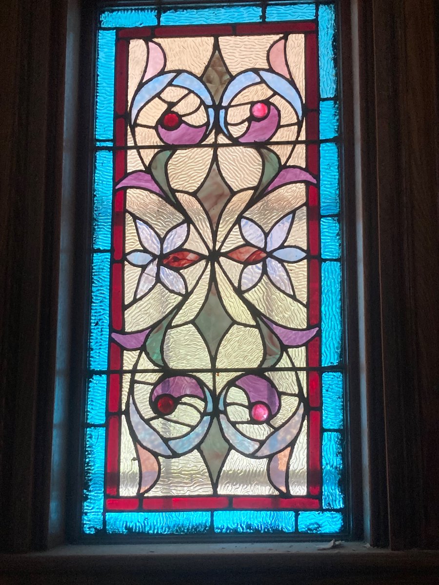 Another antique from Elm Hill. Whoever cut it used the grain of the textured glass to lead the eye through the design. It’s varied in places as well. This is the kind of thing I love to get from old windows.
