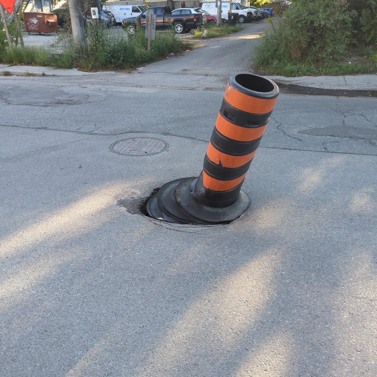 demost9's tweet photo. @311Toronto Sink hole update...it's still here. @oliviachow with all this construction already happening on st Clair you think someone might take a look at it. https://t.co/LPqmv3Jdo5