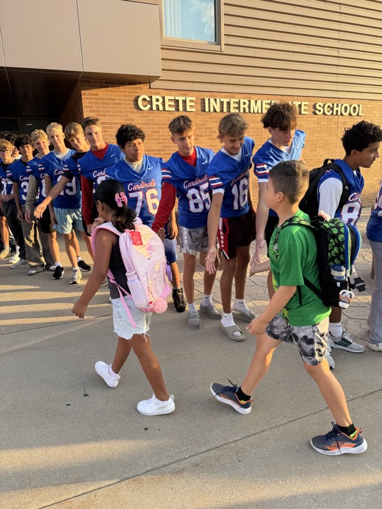 High five Friday! Thanks to the football team for greeting our students this morning. They loved it l!