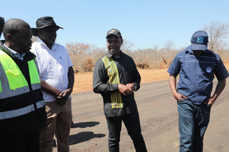 MinistryofTID's tweet photo. The momentum of national infrastructure development continues! Today, the Minister of Transport and Infrastructural Development, Hon. F.T. Mhona toured the ongoing Bulawayo-Nkayi Road Rehabilitation Project to assess and appreciate the work being done. This captures Hon Mhona's boots on the ground, eyes on the progress approach to monitoring projects.

 25 km of road is currently under rehabilitation at various stages with 10 km already been primed, while 7 km is now trafficable, bringing immediate relief to motorists.

In his address, Hon. Mhona assured the people of Nkayi that the road will be rehabilitated up to Nkayi, emphasizing that the project is a direct fulfillment of President Mnangagwa's vision of leaving no one and no place behind.

The project was also applauded by local leadership. Hon. S. Sibanda, MP for Bubi and Deputy Minister for Higher and Tertiary Education, praised the Second Republic for the upgrade, highlighting how improved connectivity is a game-changer for local development and economic growth.

Hon Mhona was accompanied by Parliamentary Portfolio Chairperson on Transport and Infrastructural Development Hon T Karikoga, Representatives from the Minister of State for Matabeleland North Province, and several Gvt officials.
##KilometerbyKilometer 
#ZeroTolerancetoPotholes