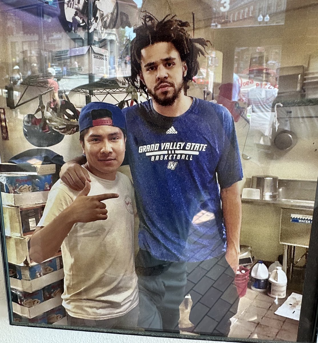 at Joe’s Pizza at Harvard, there’s a pic of J Cole wearing a Grand Valley State shirt on the wall: