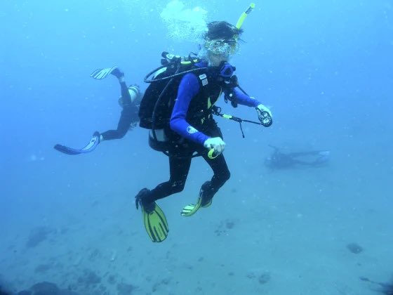 The woman on the far right is actually not alive in this photo. The middle person in the image cut off her oxygen and held her underwater before this was taken. This all happened during their honeymoon.