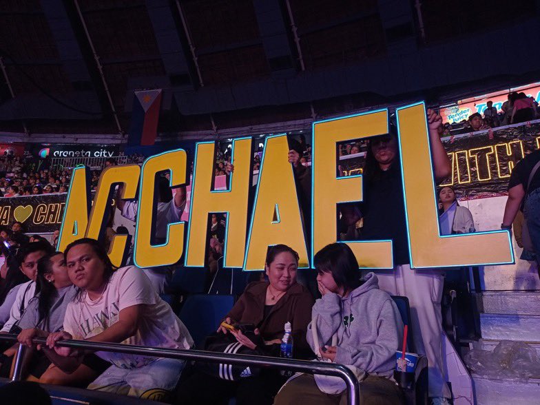 AcChaelGlobal's tweet photo. We made it. We were there. 🥹 Nakakaiyak to see our LED letters glowing at Araneta — our love lit up for Ac and Michael. We hope you saw it, and felt every bit of it. 💙💛

#AcChael | #AcBonifacio | #MichaelSager 
#pbbcolloveconcert https://t.co/VRnvBJ8Rmn