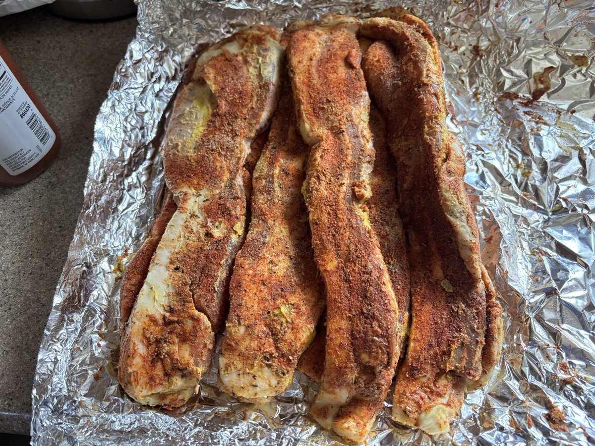 TheMarkMathur's tweet photo. Pork belly - mustard, salt, pepper, garlic, smoked paprika, and Cajun blend getting ready to hit the smoker at 225° for about 2-3 hours per pound. This was pre-sliced (but really thick). Not sure how I feel about that. Guess we’re gonna find out. #PitBoss #BBQ #MeatCandy https://t.co/HtmR4PFyaA