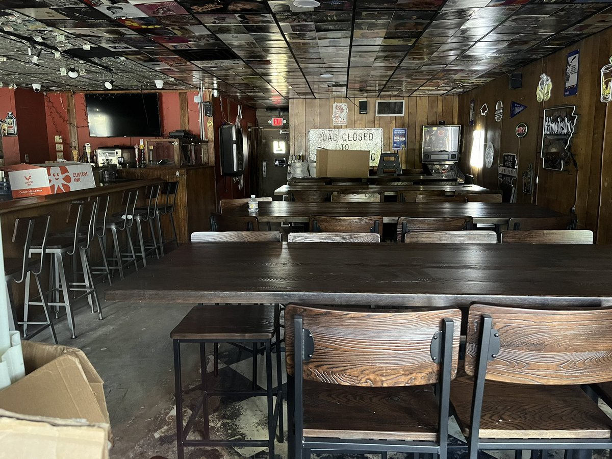 ARChickenStrips's tweet photo. It looks like Town Pump, under new ownership, is getting close to reopening. Peeking through the windows, I see new tables, new stools, the pool tables are gone, while the front and back patios have new furnishings. It’s quite an upgrade and was very needed! @EatArkansas https://t.co/bmhPB4CPNM