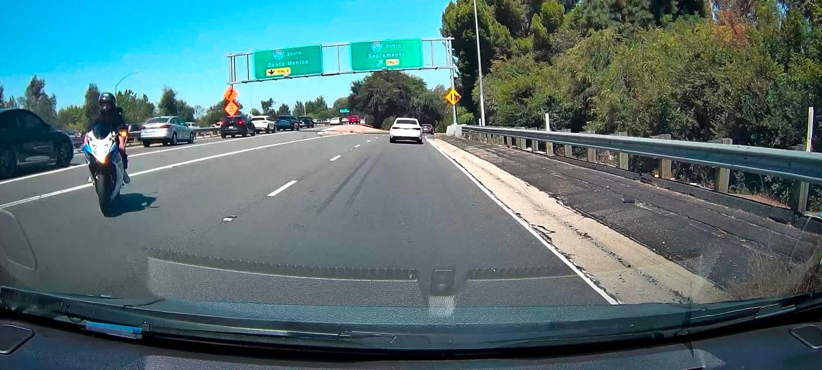 steztwitt's tweet photo. @KTLA #ktla on the 101 earlier today merging into the 405 North and this idiot on his motorcycle comes right towards us going the wrong way. He also had some friends in the middle of both freeways filming something wearing motorcycle helmets 🫣🙄. Did anyone else see this? https://t.co/45QDwp1Nmu