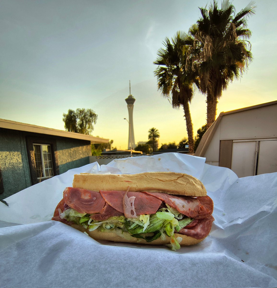 MovestroVegas's tweet image. Zesty Italian sandwich delivered by Earl of Sandwich, with a view of the Strat from my yard. #TwitPicForMark