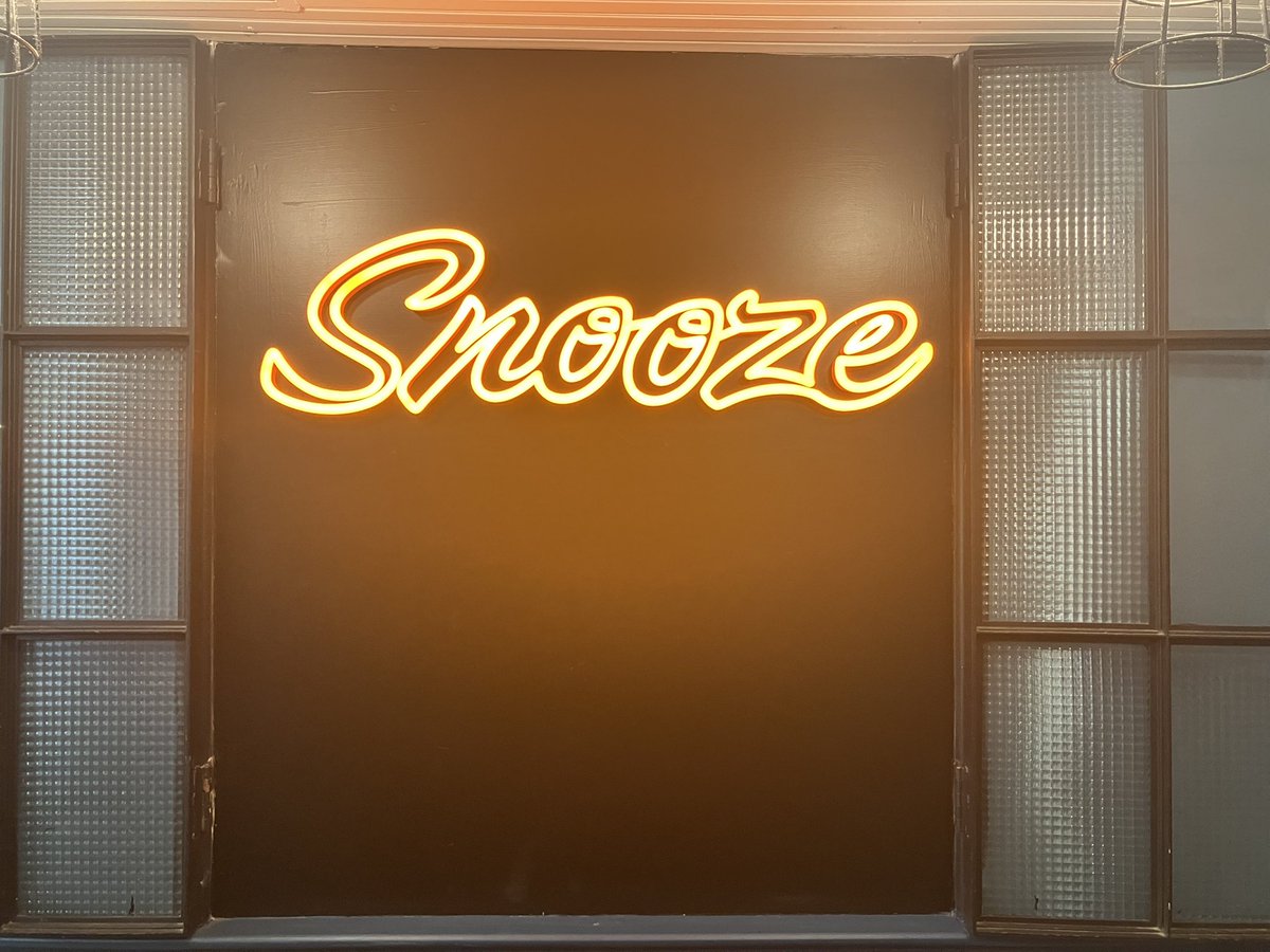 Neon sign at Snooze an A.M. Eatery, a vibrant American restaurant in Denver famous for brunch.