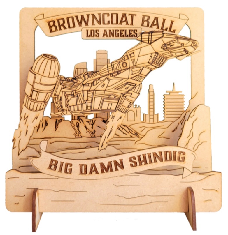 Three versions of Browncoat Ball 2025 shirts, a metal flask and a Browncoat Ball 2025 Wood Diorama.

browncoatball.com/2025/shop/