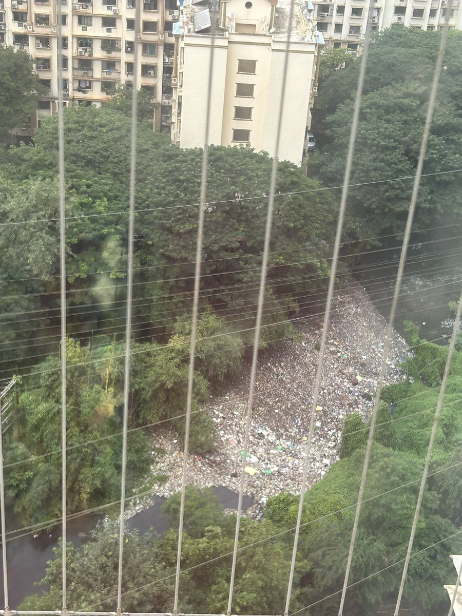 joshishwetap's tweet photo. Garbage has piled up in the nallah adjacent to Lodha Luxuria Complex , Majiwada , Thane , turning it into a mosquito breeding ground. Urgently needs cleaning to prevent health hazards . @TMCaTweetAway please take action. https://t.co/TIG4bsxEwX