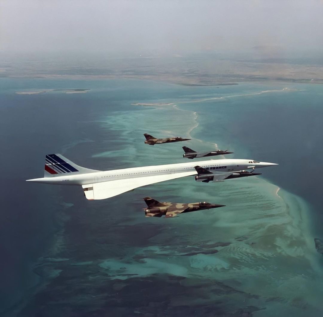 planesanity's tweet photo. Concorde flying over Djibouti, escorted by French fighter jets since President François Mitterrand was on board, 1988 https://t.co/Bpno5hN7Zc