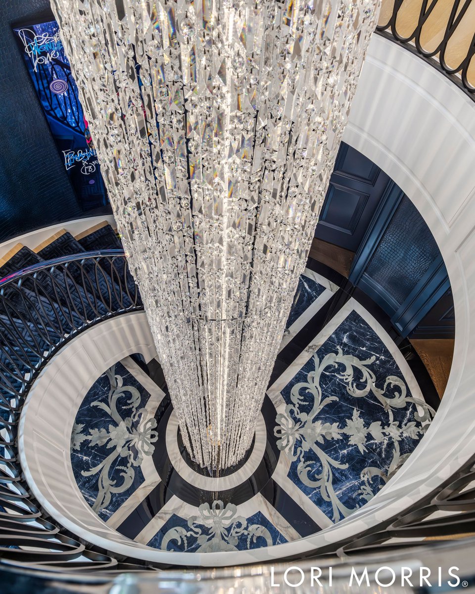 lorimorrisinc's tweet photo. “Take me down to paradise city” ❤️ 
#lorimorris #lorimorrisdesign #interiordesign #gunsandroses #custominteriors #staircasedesign #grandentrance #luxurystaircase #crystalchandelier #blueandwhite #elegantflooring #statementlighting #highendinteriors #spiralstaircase #bolddesign https://t.co/geiZpkCBMN