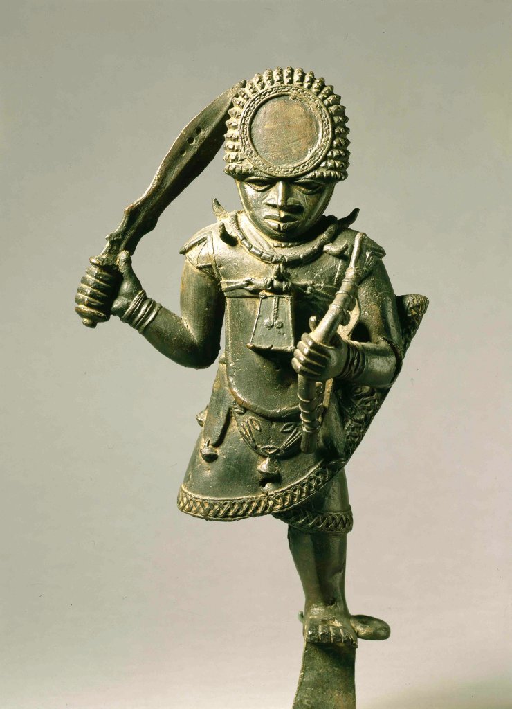 Benin 16th-17th century warrior cast holding a sword and a bow in the Benin Amour.
