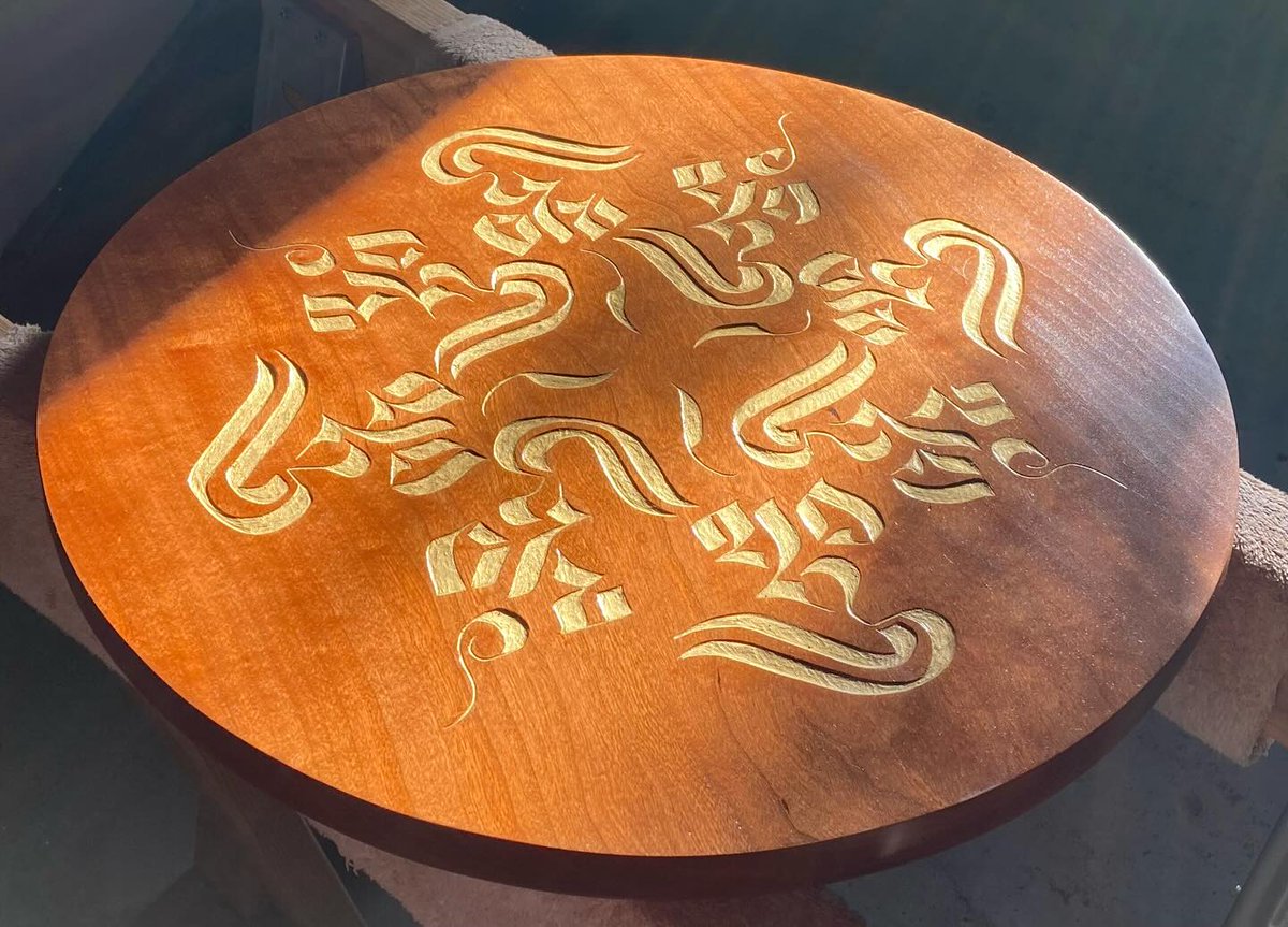 TBAlphabets's tweet image. Finished. “Spontaneous Perfection,” based on Tibetan calligraphy by Golok Akyung, seen here in early-morning light and shadow. Available either as a piece of circular wall art or as a side table with hairpin legs. If you’re interested, contact me!
