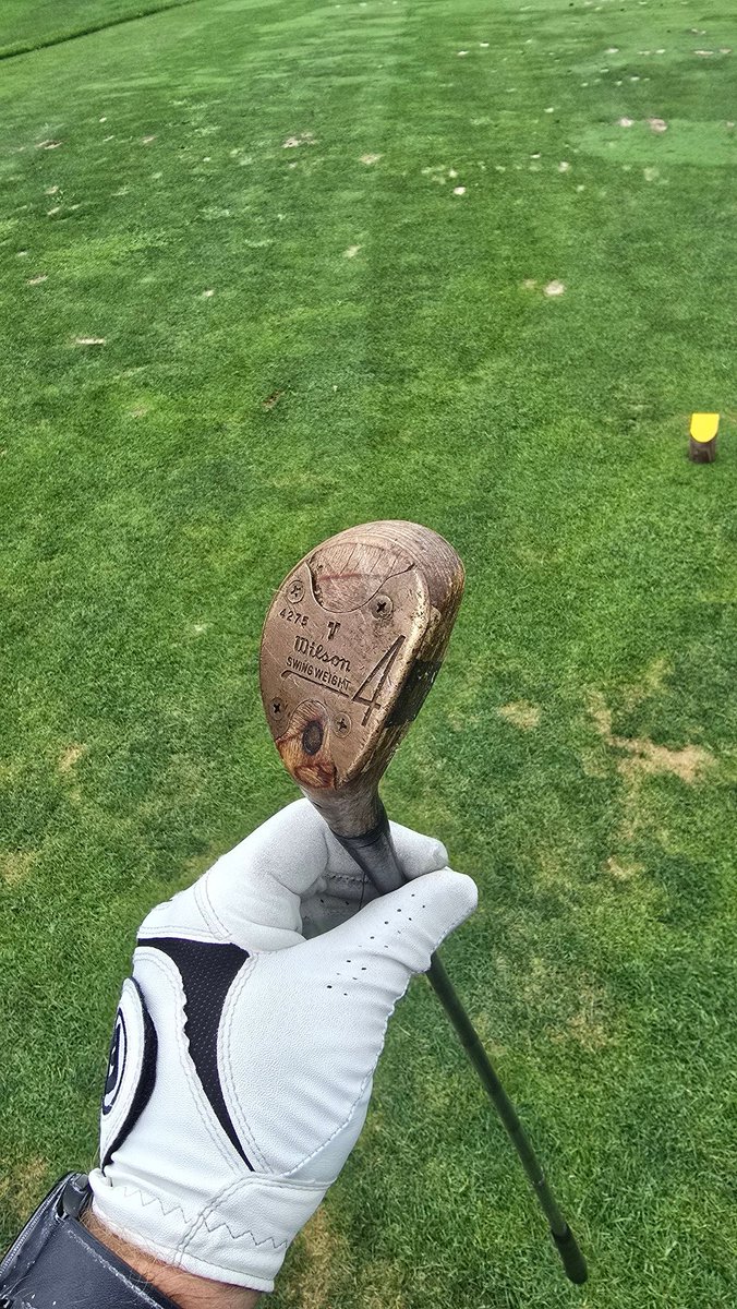 My dad is in town and pulled this club from his bag. He said it was his dad's, it's 70 years old, and he typically plays it once a round. Then my dad put his shot on the middle of the green from 190.