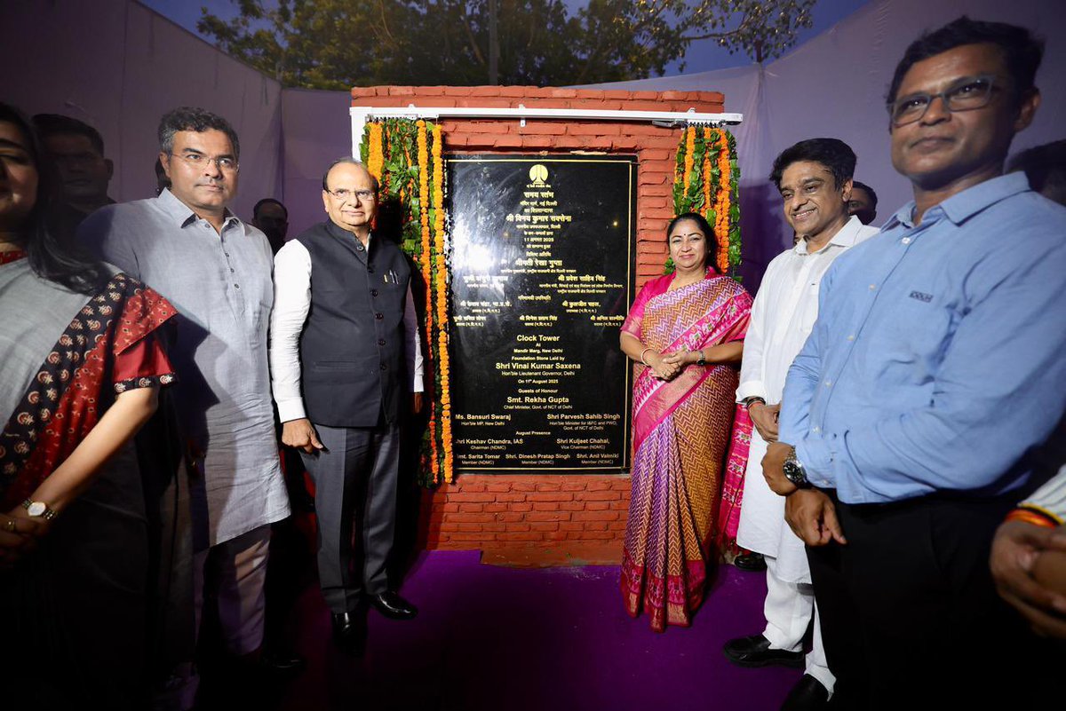 LtGovDelhi's tweet photo. Laid the foundation stone of an iconic Clock Tower at Mandir Marg in New Delhi, along with Hon’ble Chief Minister, Smt Rekha Gupta, Hon’ble Minister, Shri Pravesh Sahib Singh and Hon’ble MP, Bansuri Swaraj. 

The nearly 27 meter tall clock tower, being built by New Delhi Municipal Council, derives its elements from Delhi’s different historical architectural styles - dome from the India Gate, columns from the temple complex of Qutub Minar and outer brick construction from Shahjahanabad - making it a modern day architectural masterpiece. 

Positioned at the strategic Shankar Road - Mandir Marg junction, that serves as the entrance to the NDMC area, the clock tower would catch maximum eyeballs from the daily passersby as well as tourists visiting the area. 

This clock tower would prove to be a landmark not only for the people of Delhi but also a milestone in the journey of Delhi’s urban redevelopment in which NDMC is playing a critical role.