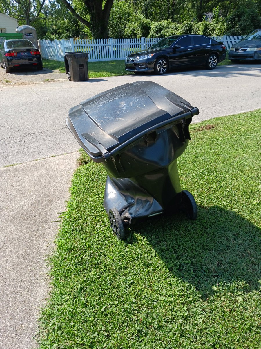 holycapra's tweet photo. Can I get a new trash can, @LouMetro311? The garbage truck grabbed it, emptied it, didn't unclaw it, dragged it through the neighbor's yard creating a trench, and was brought back like this. https://t.co/NRIEAO1ow4