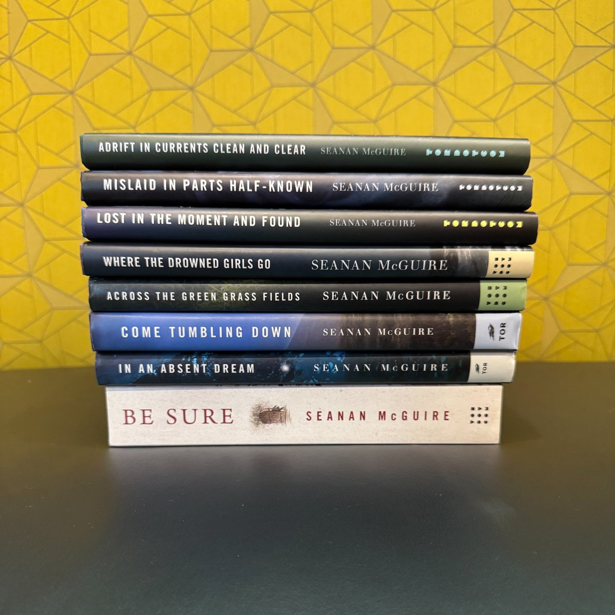 The Wayward Children series by <a href="/seananmcguire/">Seanan McGuire</a> is the story of Eleanor West’s School for Wayward Children, a boarding school for children who come home from  fantasy worlds &amp; can’t adjust to their new lives. 

The next installment, Through Gates of Garnet and Gold, coming 1/6/26!