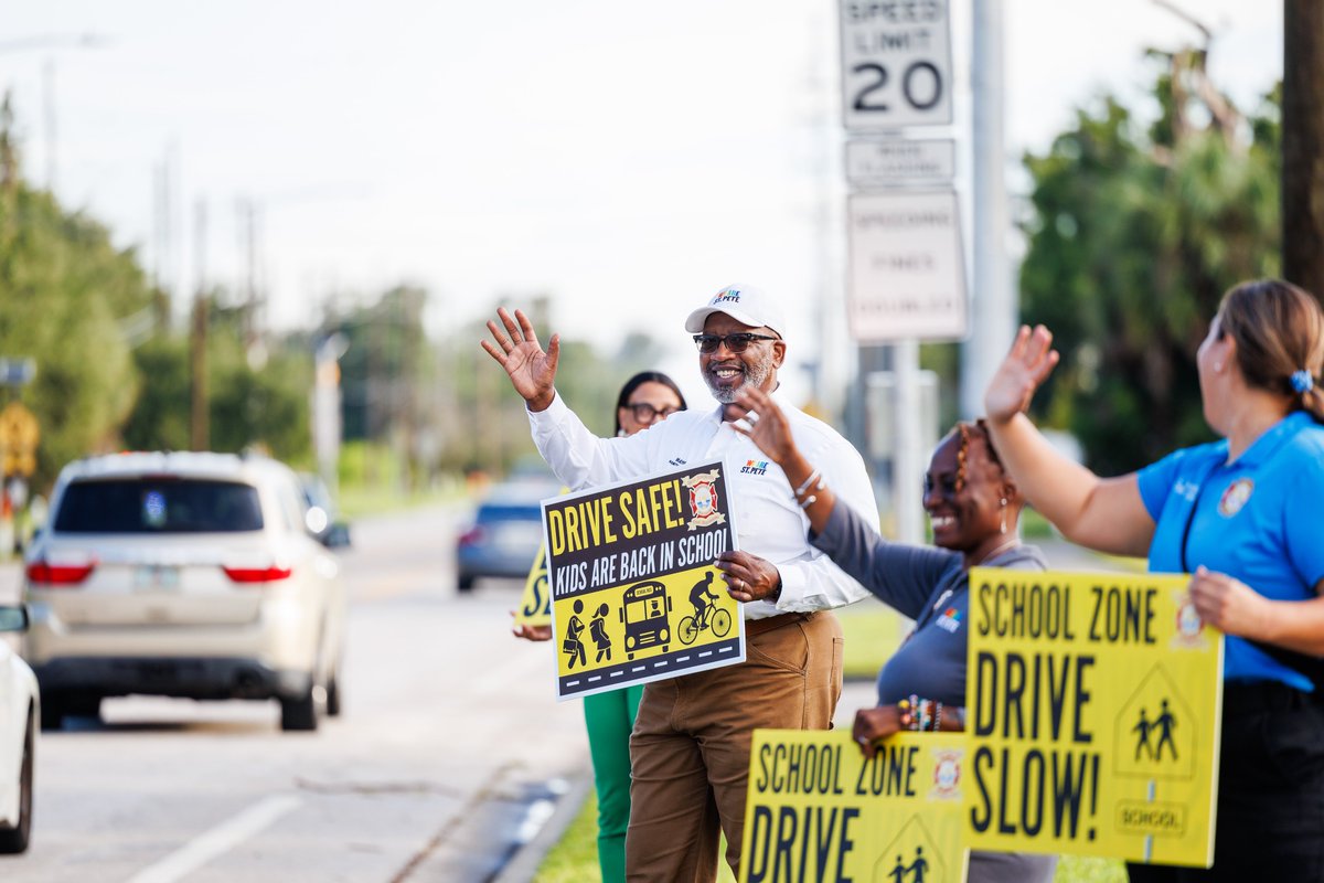 StPeteFL's tweet photo. Happy #PCSFirstDay, St. Pete! 🚸📚 Today, @MayorKenWelch, City staff, and public safety teams greeted families and students heading back to school. 

Here’s a friendly reminder — please slow down in school zones! 

Wishing everyone a wonderful school year! #WeAreStPete https://t.co/uocSg5Wzrh