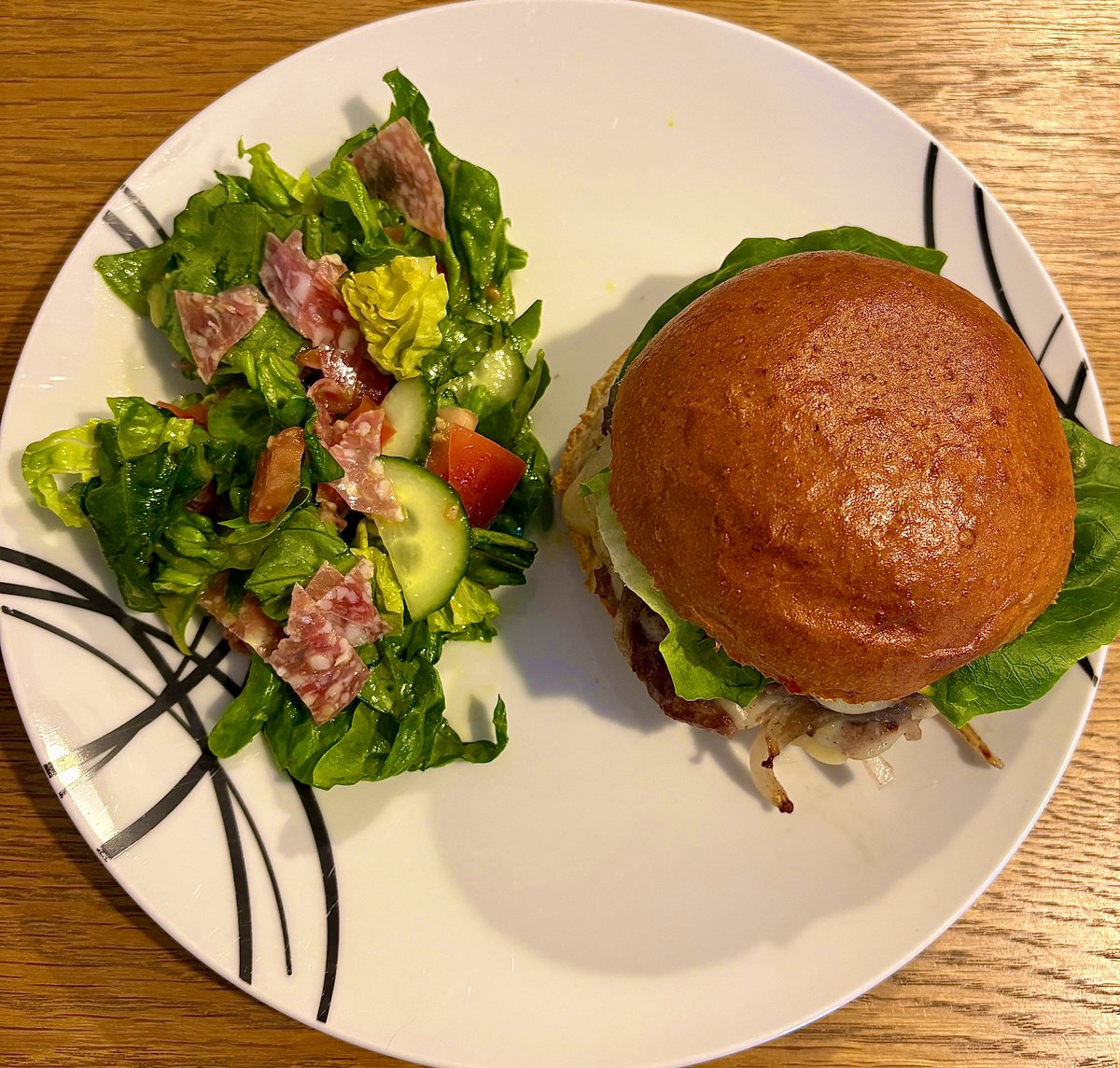 Smash burgers served with a little salami salad in honey mustard dressing