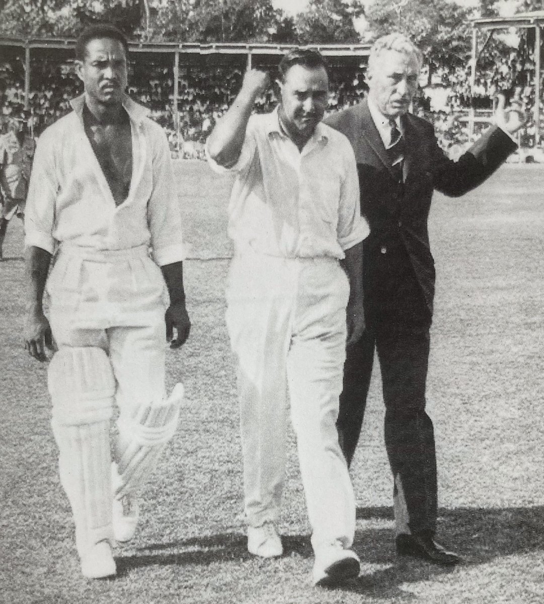 With, for once, a face like thunder The Greatest, with opposite number Colin Cowdrey and the President of the Jamaican Cricket Association after the crowd rioted in the Kingston Test in 67/68 - at the crease at the time The Greatest went on to complete one of his finest hundreds