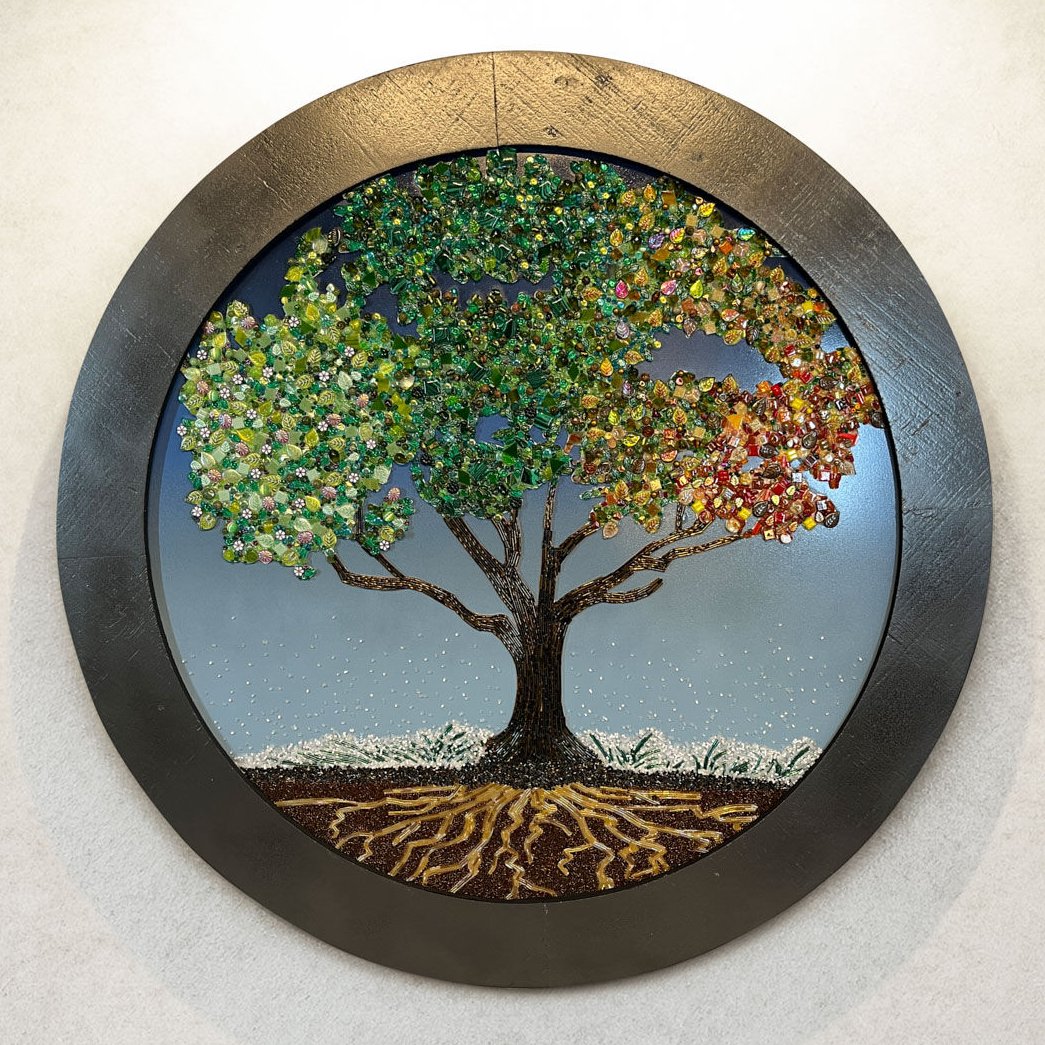 Beads in graceful, organic shapes—leaves, flowers, rounds, and rods—beautifully entwine in this elegant "Tree of Life" mosaic, crafted by artist Sabrina Frey.
You can find more details about this design inspiration here: firemtn.co/4mXV9NV