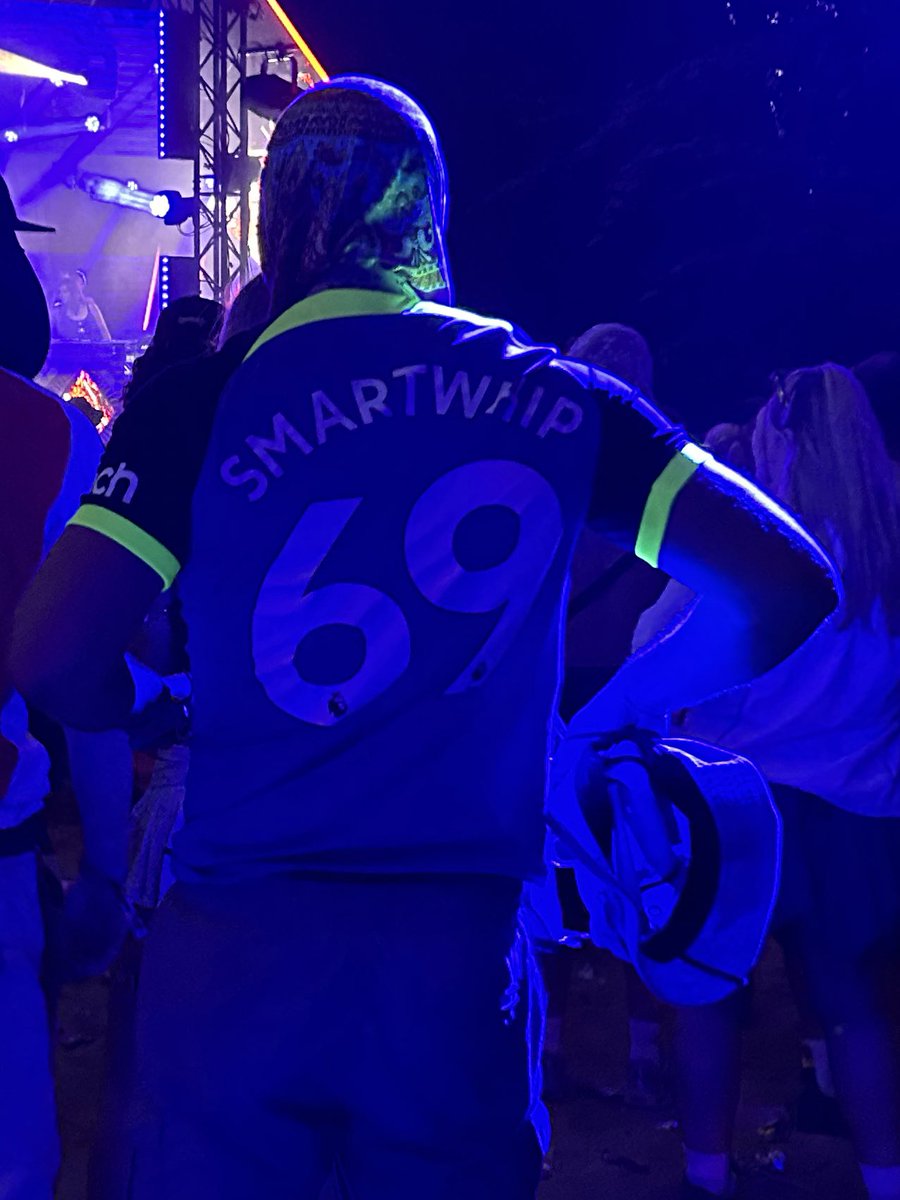 Yer fella wears a “smartwhip 69” shirt to boomtown