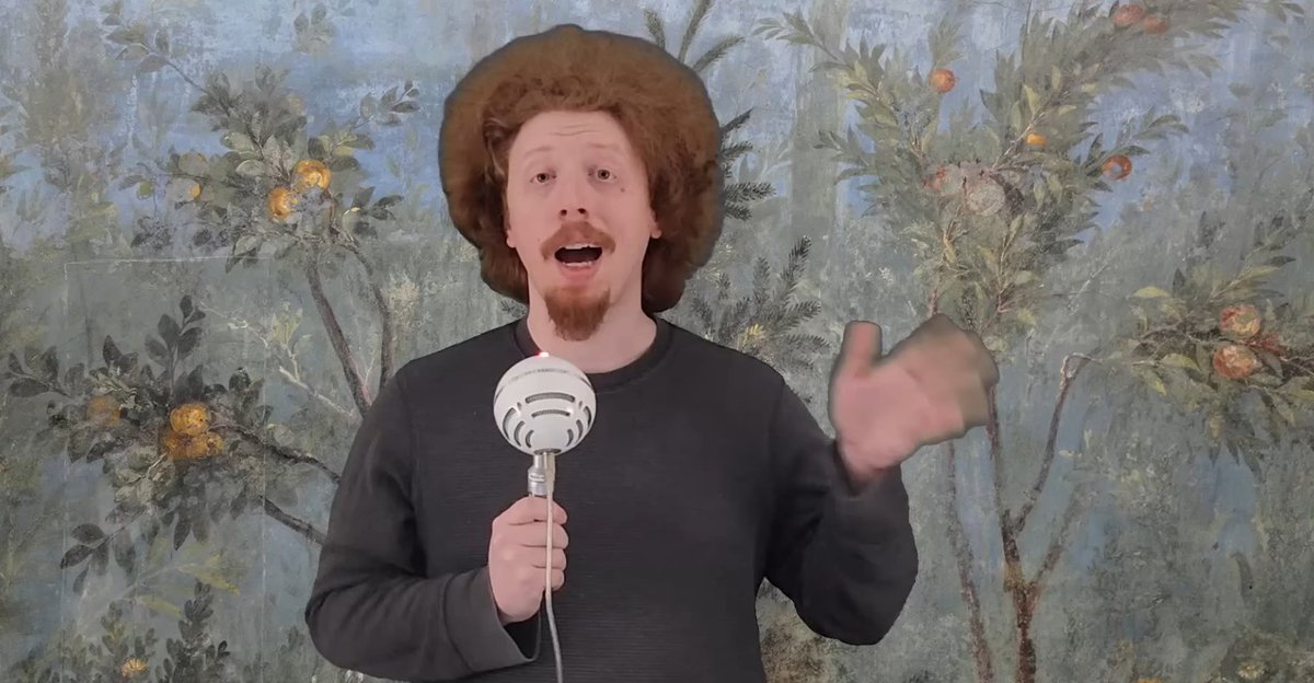 Why does this man look like the ginger love child of Bob Ross and Leon Trotsky?