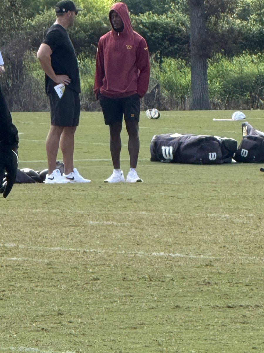 Adam Peters talking to Terry McLaurin at practice.