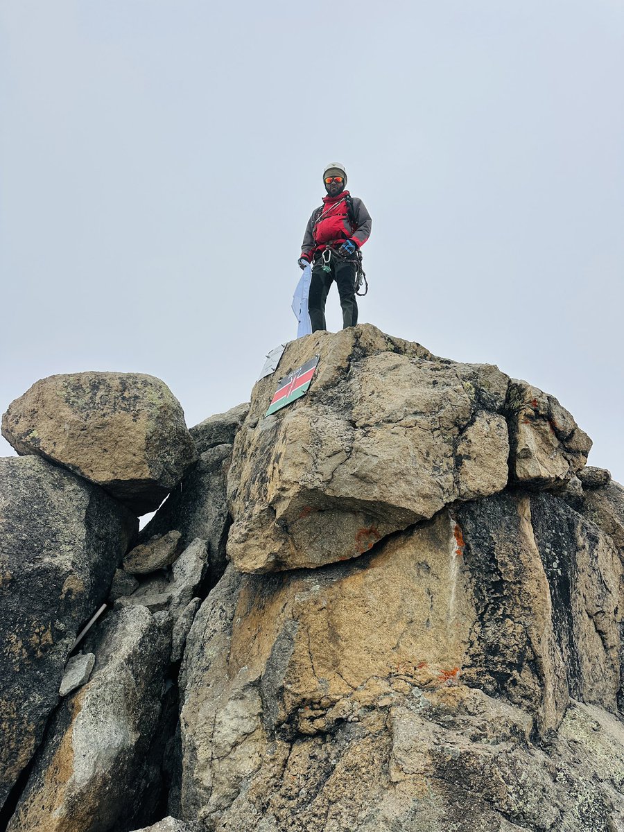 You see those rocks behind me, Batian, the second highest peak in Africa (5199m) is up there! And exactly one month ago, I was up there!

Second slide, you can see the joy David, our guide and I were swimming through, because a seamless summit, especially after a day of bad