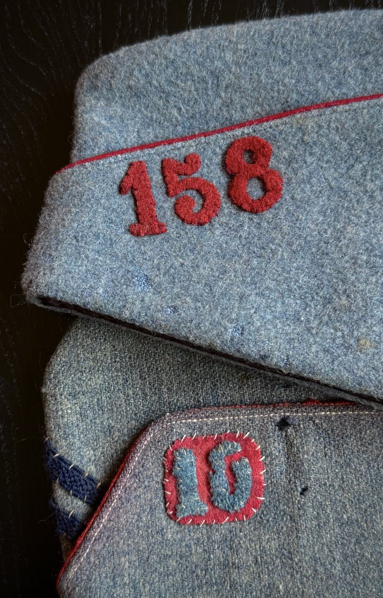 A close up of the regimental numerals on two of my French WWI sidecaps. An M1891/15 model (top) and a 1918 model (bottom).