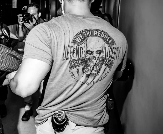 newschica's tweet image. Detail from a photo by Mark Peterson/The New Yorker. #ICE agents popping out of moving vans at parking lots &amp;amp; wearing t-shirts with a skull look more like rightwing white nationalist militia thugs. Who are these people? #detention #Immigrants #policestate