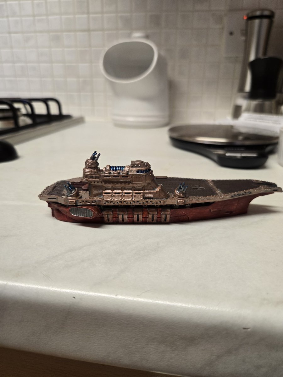 Dravreth's tweet image. Finished painting my first dystopian wars ship, the Templehoff fleet carrier im not good at this but I like colours ive used.