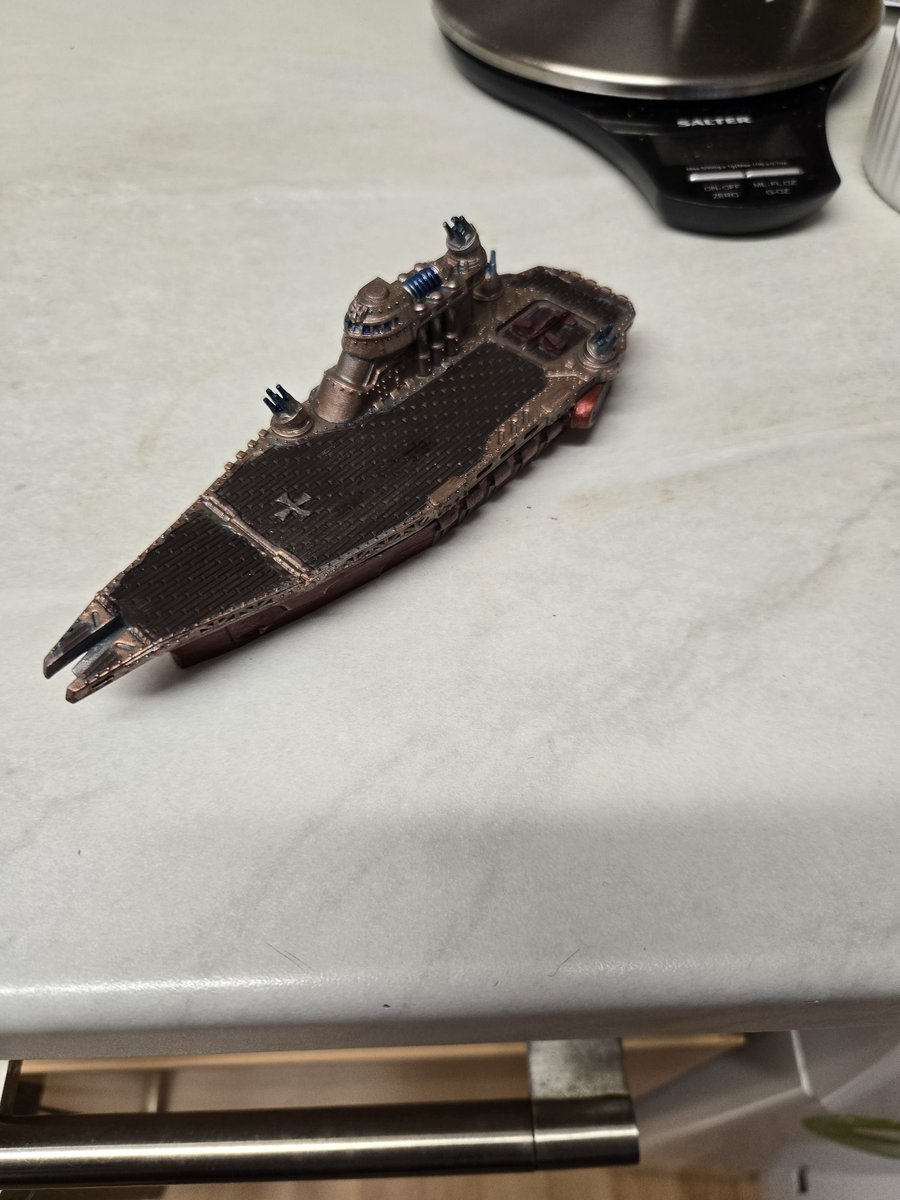 Dravreth's tweet image. Finished painting my first dystopian wars ship, the Templehoff fleet carrier im not good at this but I like colours ive used.