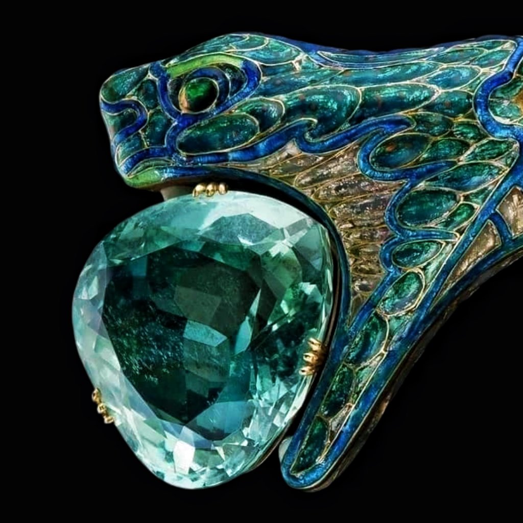 Art Nouveau head ornament, circa 1904.

Designed by the renowned French jeweler Georges Fouquet.

Gold, silver and enamel with a large aquamarine gemstone held in the serpent's mouth.
