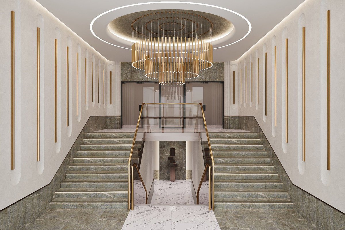 CSTERNDesign1's tweet photo. Grand yet grounded — this sculptural staircase welcomes with timeless symmetry and quiet luxury. Rich green stone steps and golden vertical accents guide the eye upward to the showstopping chandelier, a contemporary cascade of warm brass and light.

Monumental, refined, and designed to impress at every level.

#luxuryinterior #grandentrance #staircasedesign #modernclassic #interiorinspiration #brassdetails #marbleflooring #highenddesign #interiorcomposition #hotelinterior #lobbygoals #designstatement #refinedaesthetics #lightingdesign #contemporaryelegance
